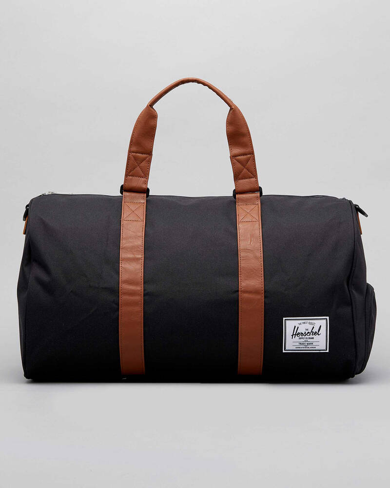 Shop Herschel Novel Duffle Bag In Black/tan - Fast Shipping & Easy ...