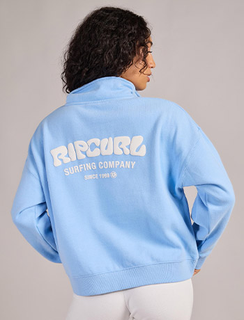 Woman wearing a red top with jeans