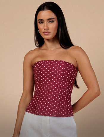 Woman wearing a red top with jeans