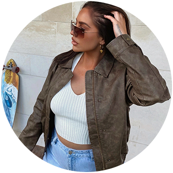 Woman posing with a white handbag