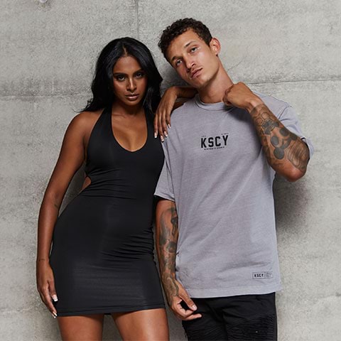 A man and a woman posing for the camera wearing City Beach New Arrivals