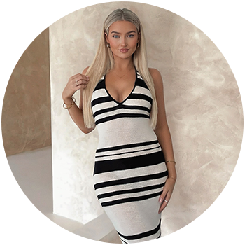 Brunette woman wear a blue and brown halter dress