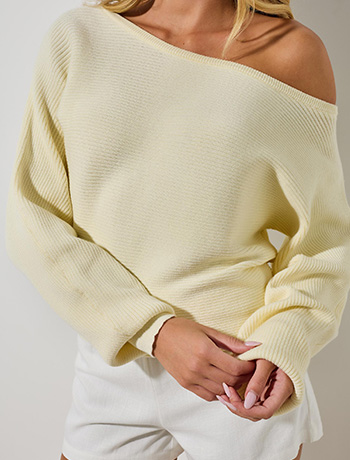 Woman wearing a red top with jeans