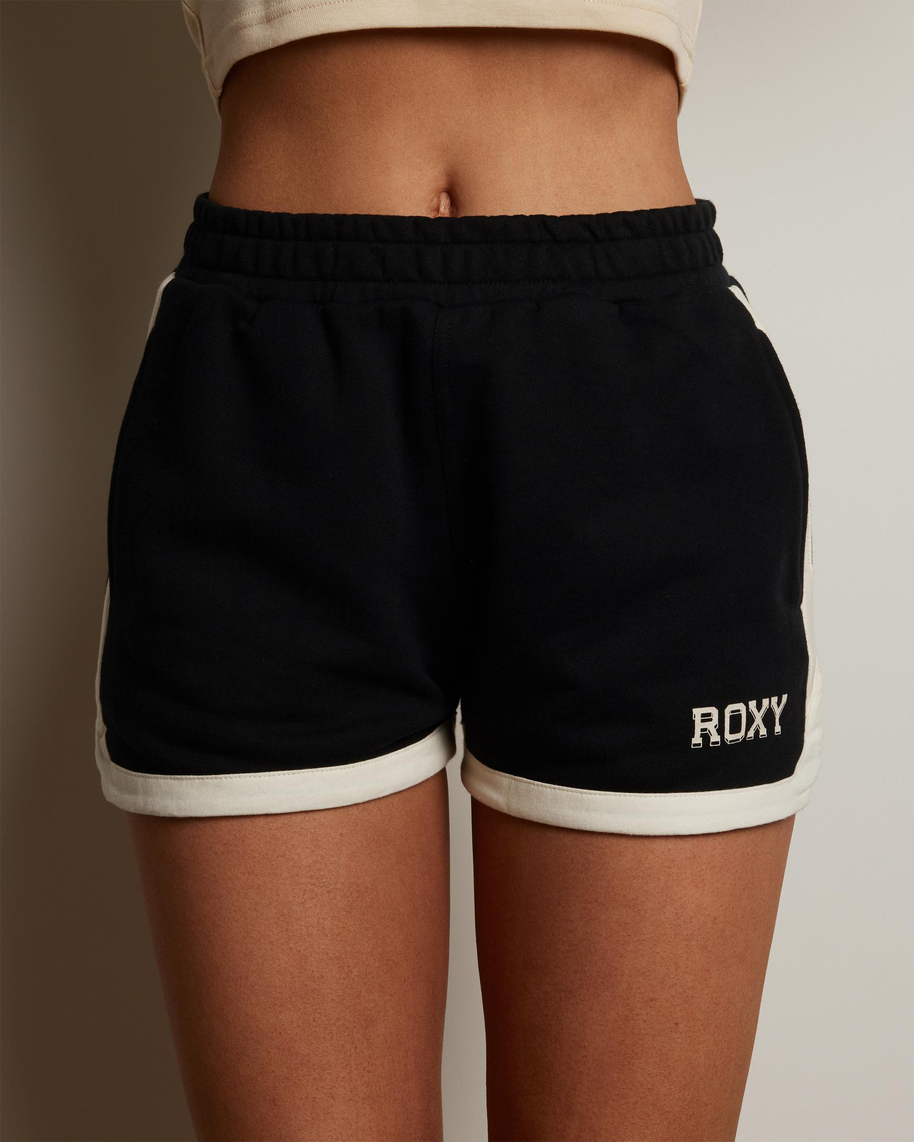 Shop Roxy Essential Energy Scallop Shorts In True Black - Fast Shipping ...