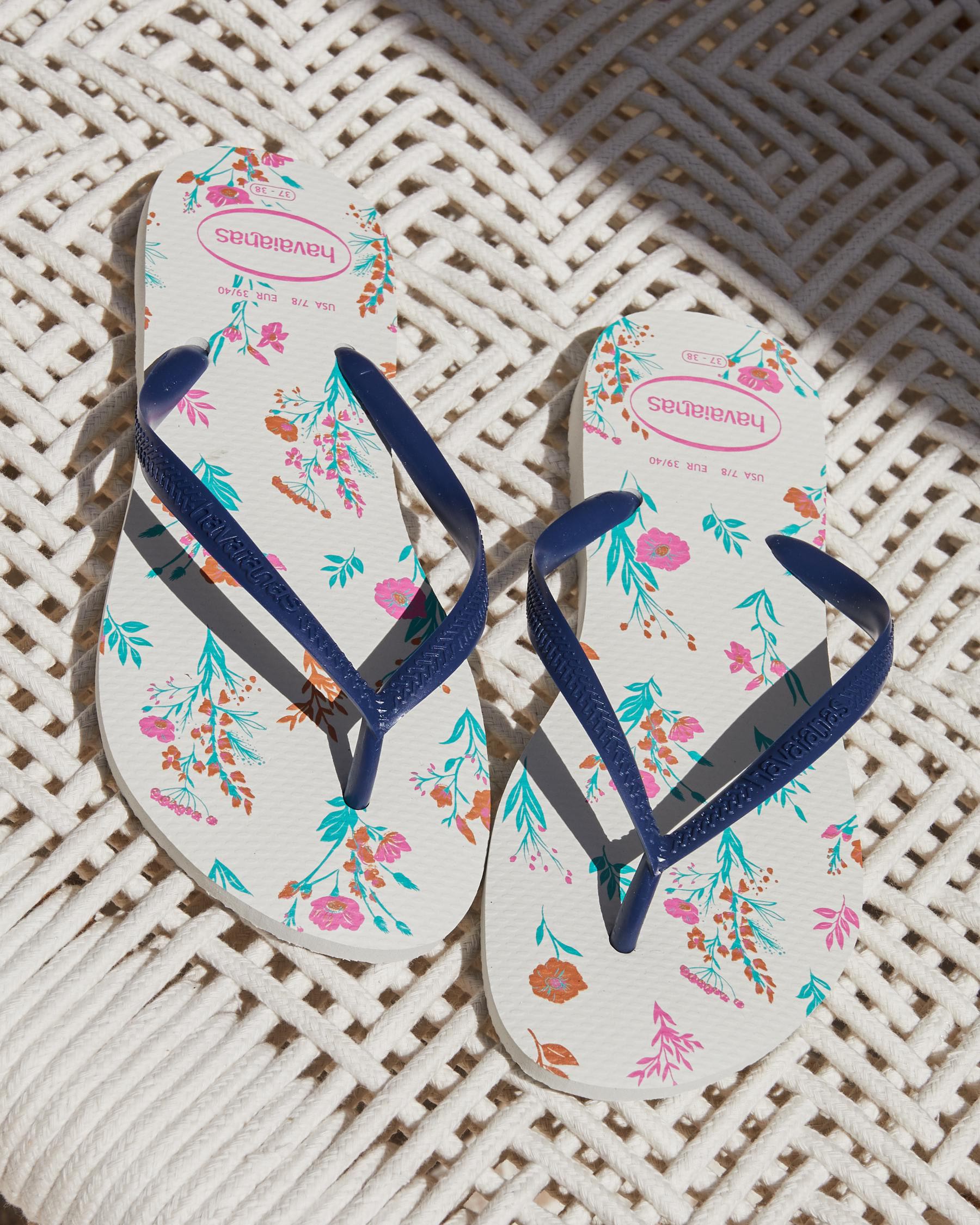 Shop Havaianas Slim Romance Thongs In White/navy Blue - Fast Shipping ...