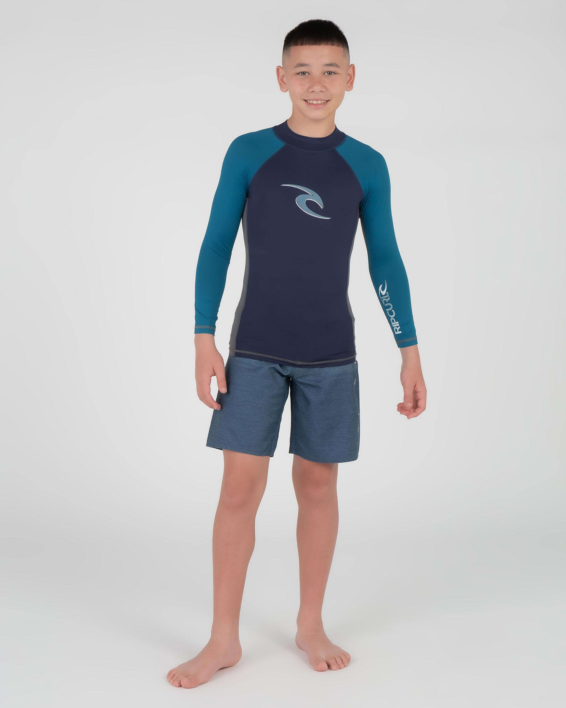 Shop Rip Curl Boys' Wave Long Sleeve Rash Vest In Navy - Fast Shipping ...