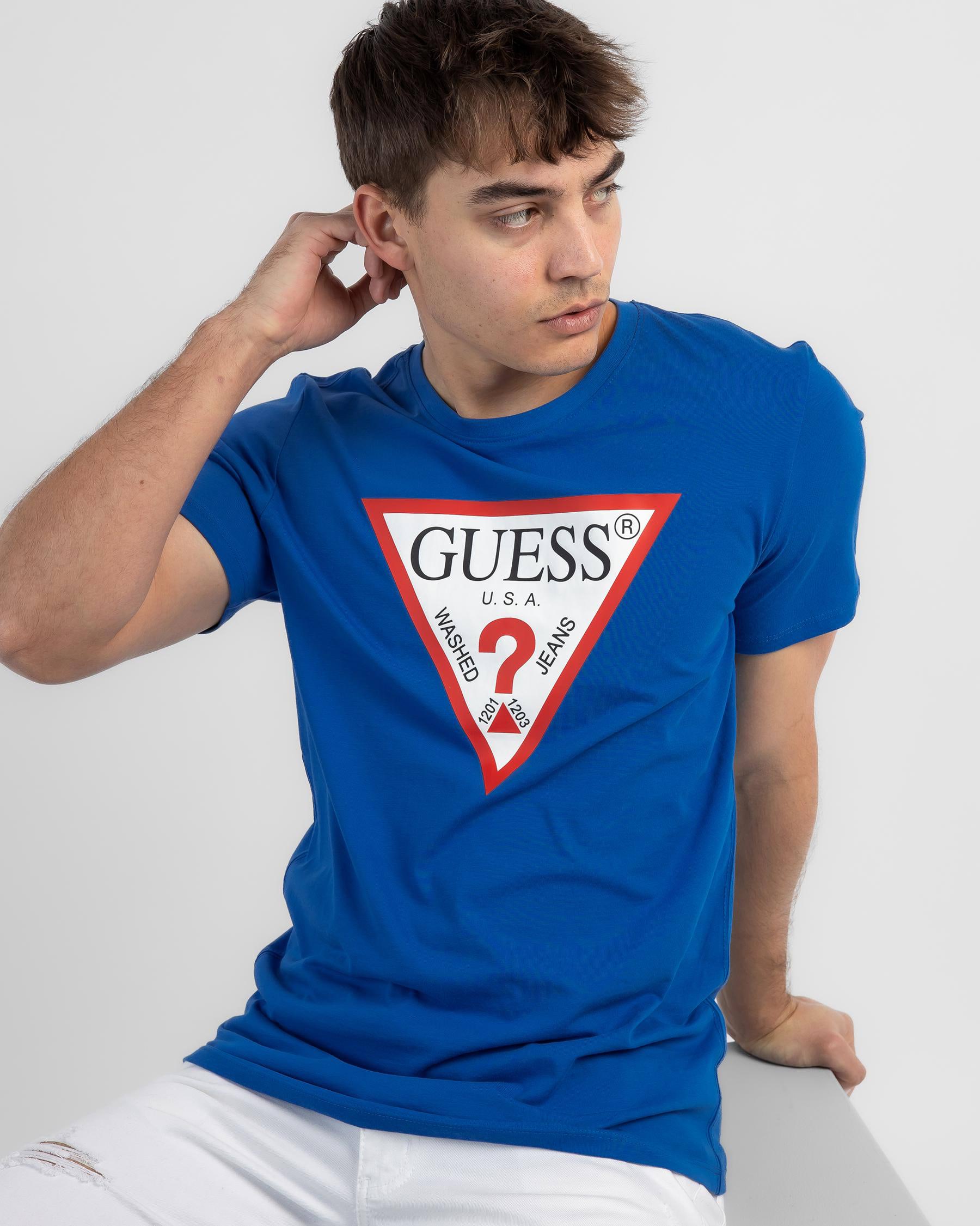 GUESS CN Original Logo T-Shirt In Daphne Blue - Fast Shipping & Easy ...