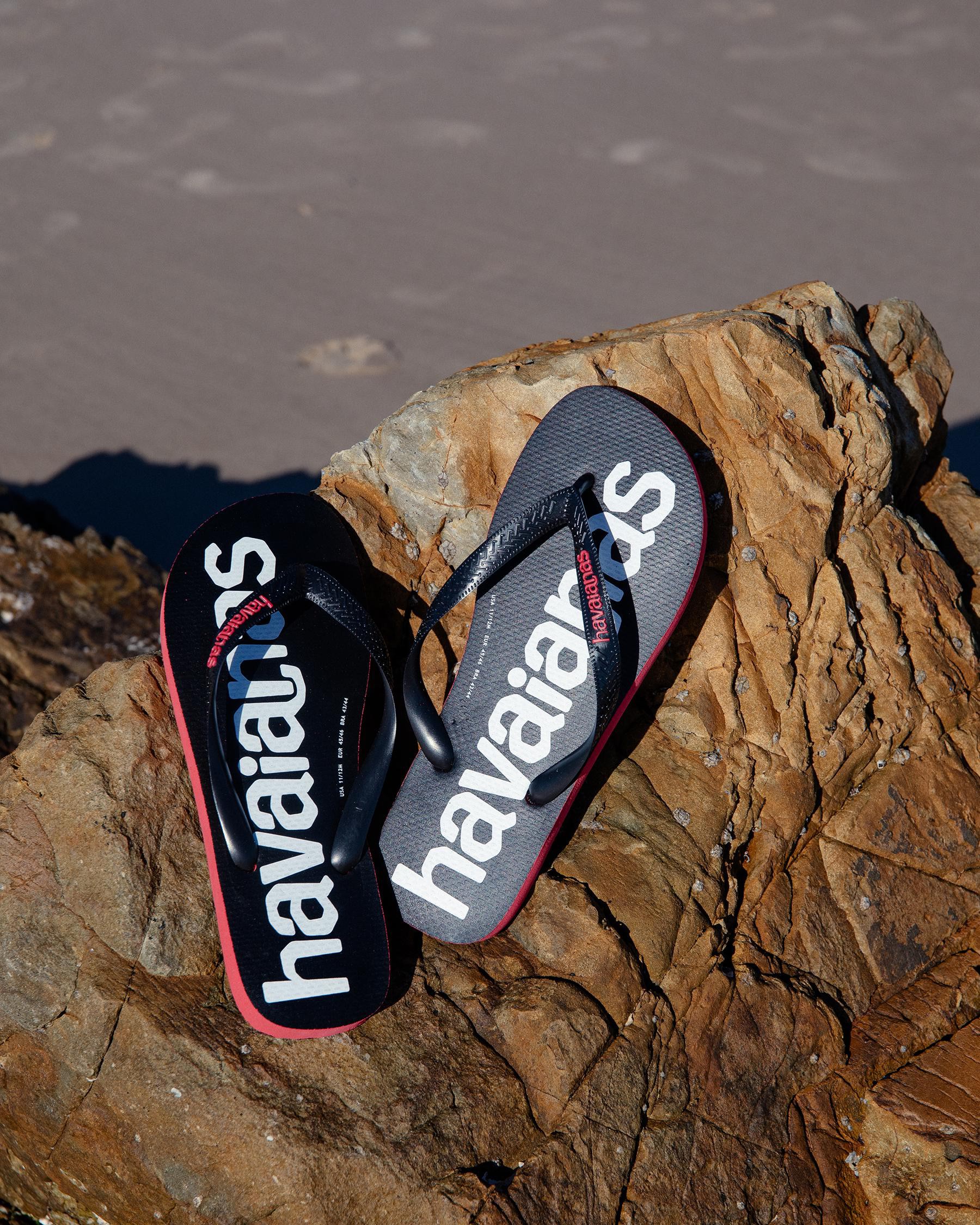Shop Havaianas Top Logomania 2 Thongs In Black/ruby Red - Fast Shipping ...